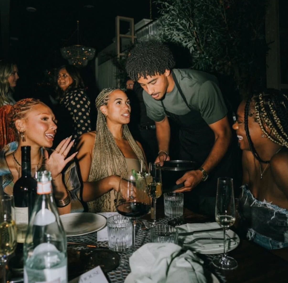 Guests sharing a moment around the table