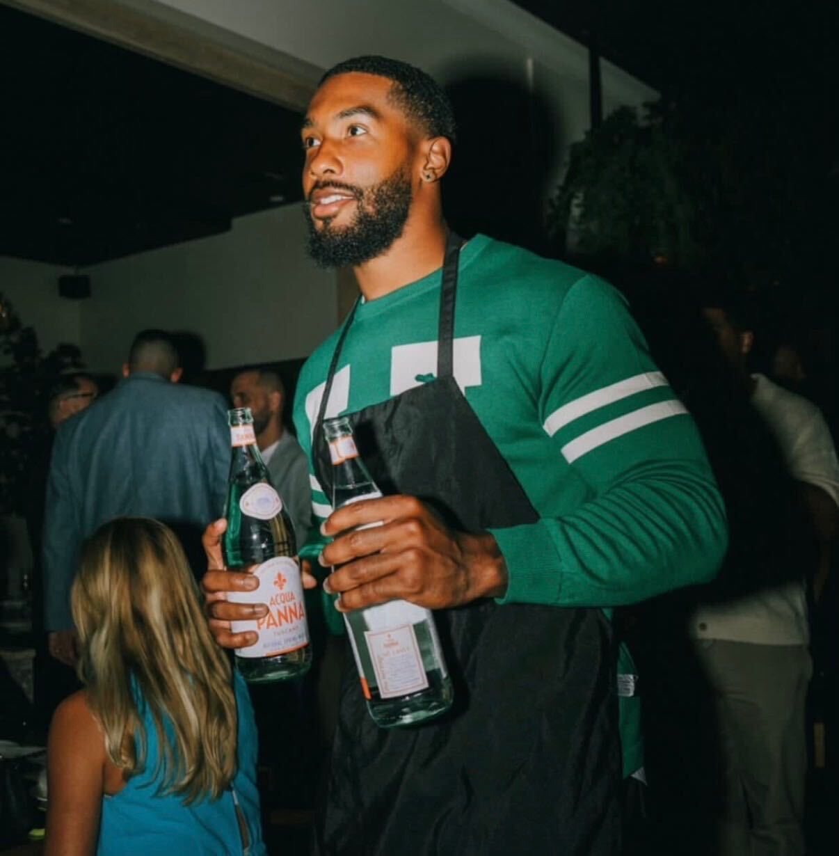 Athlete serving guests at Celebrity Waiter Night