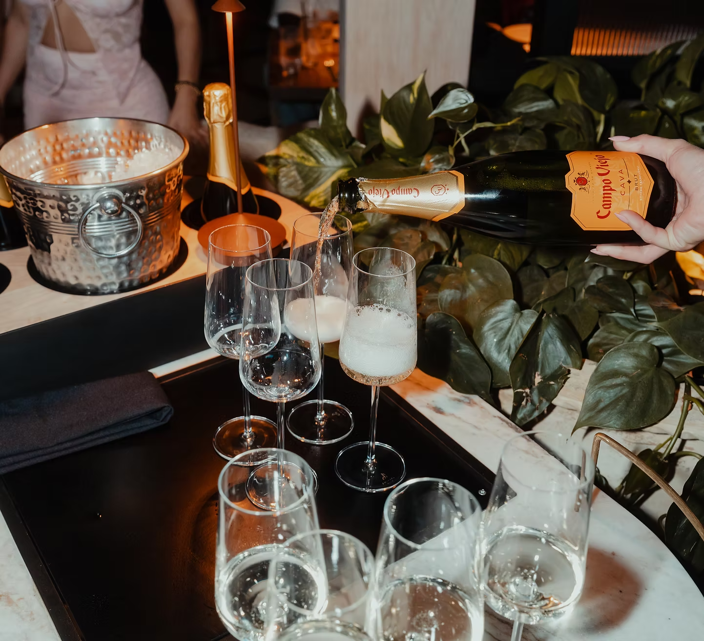 Champagne being poured for guests at the event