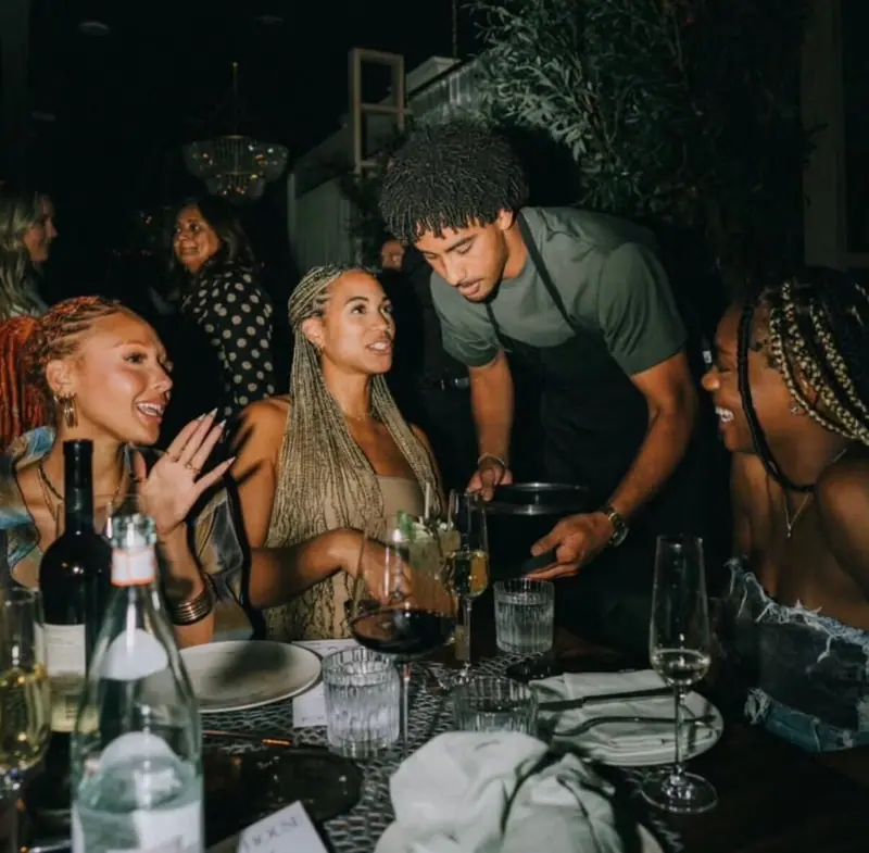 Guests sharing a moment around the table